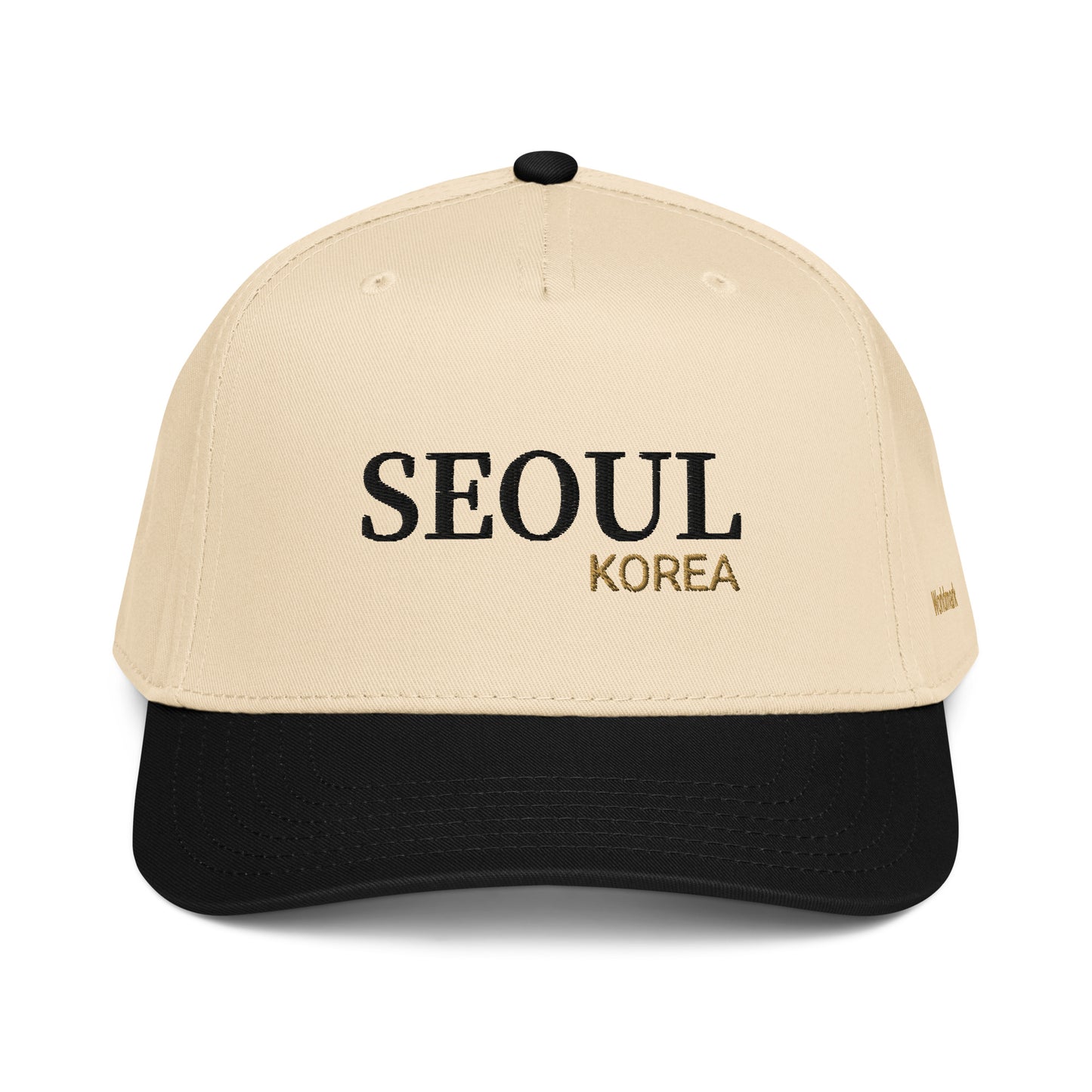 Two-tone cream and black Seoul embroidered cap featuring gold “KOREA” text and Worldmark logo — modern Korean minimal style.
