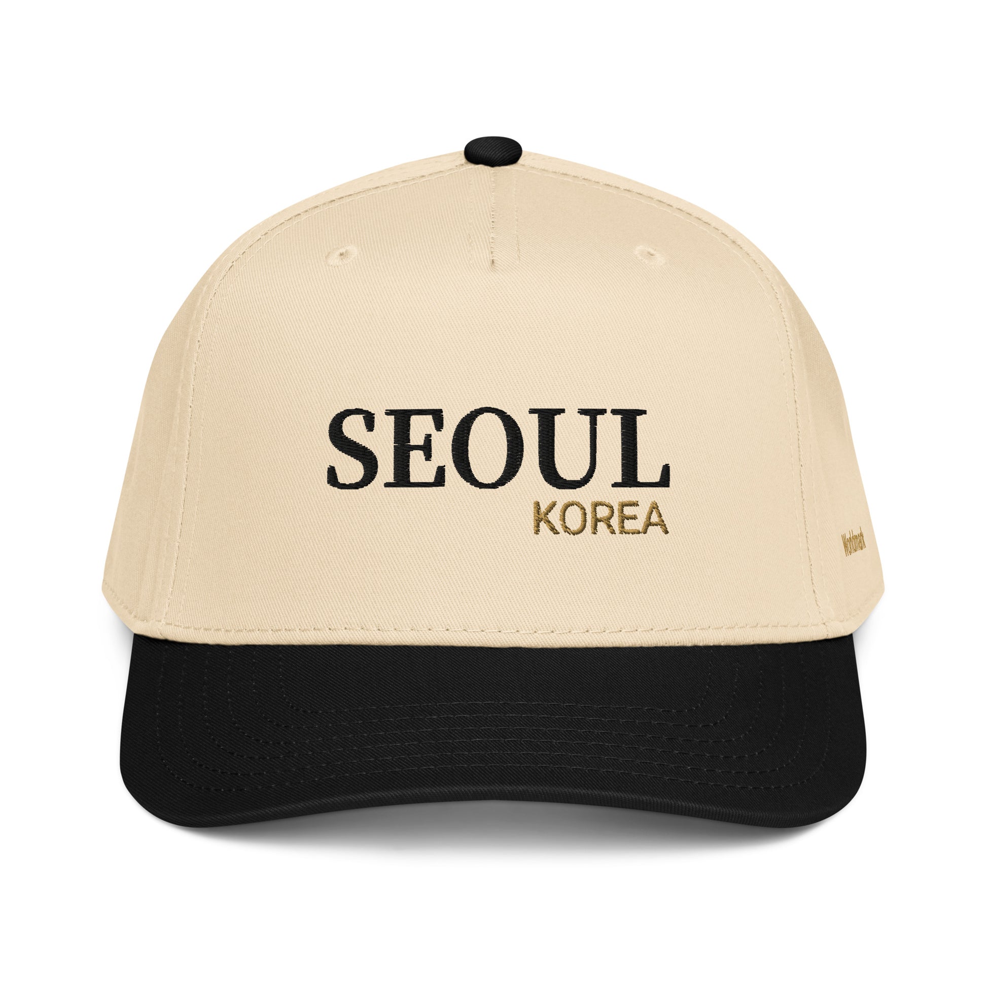 Two-tone cream and black Seoul embroidered cap featuring gold “KOREA” text and Worldmark logo — modern Korean minimal style.