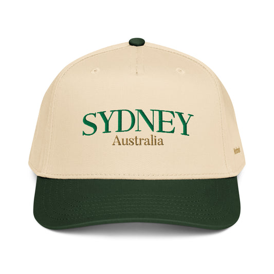 Two-tone cream and green Sydney embroidered cap featuring gold “Australia” text and Worldmark logo — coastal minimal Australian style.