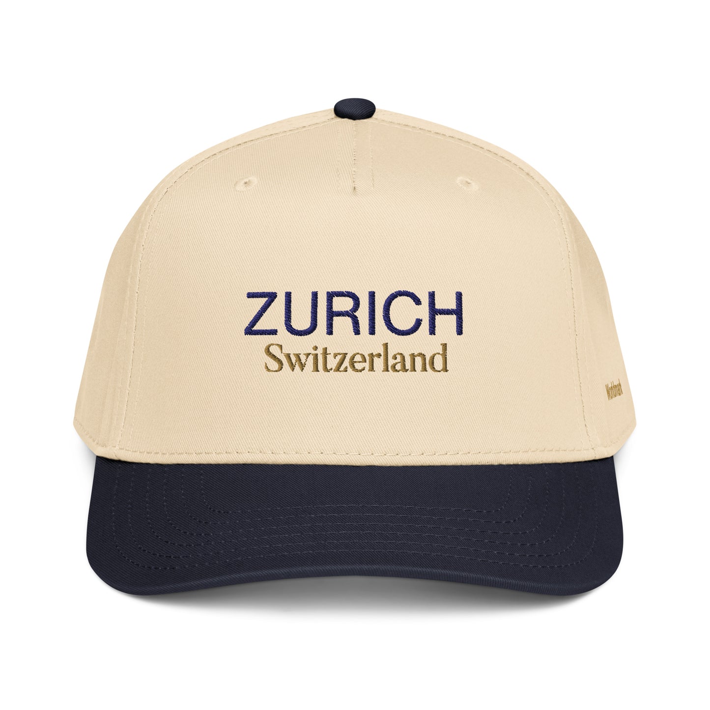 Two-tone cream and navy Zurich embroidered cap featuring gold “Switzerland” text and Worldmark logo — inspired by Swiss elegance and minimal European design.