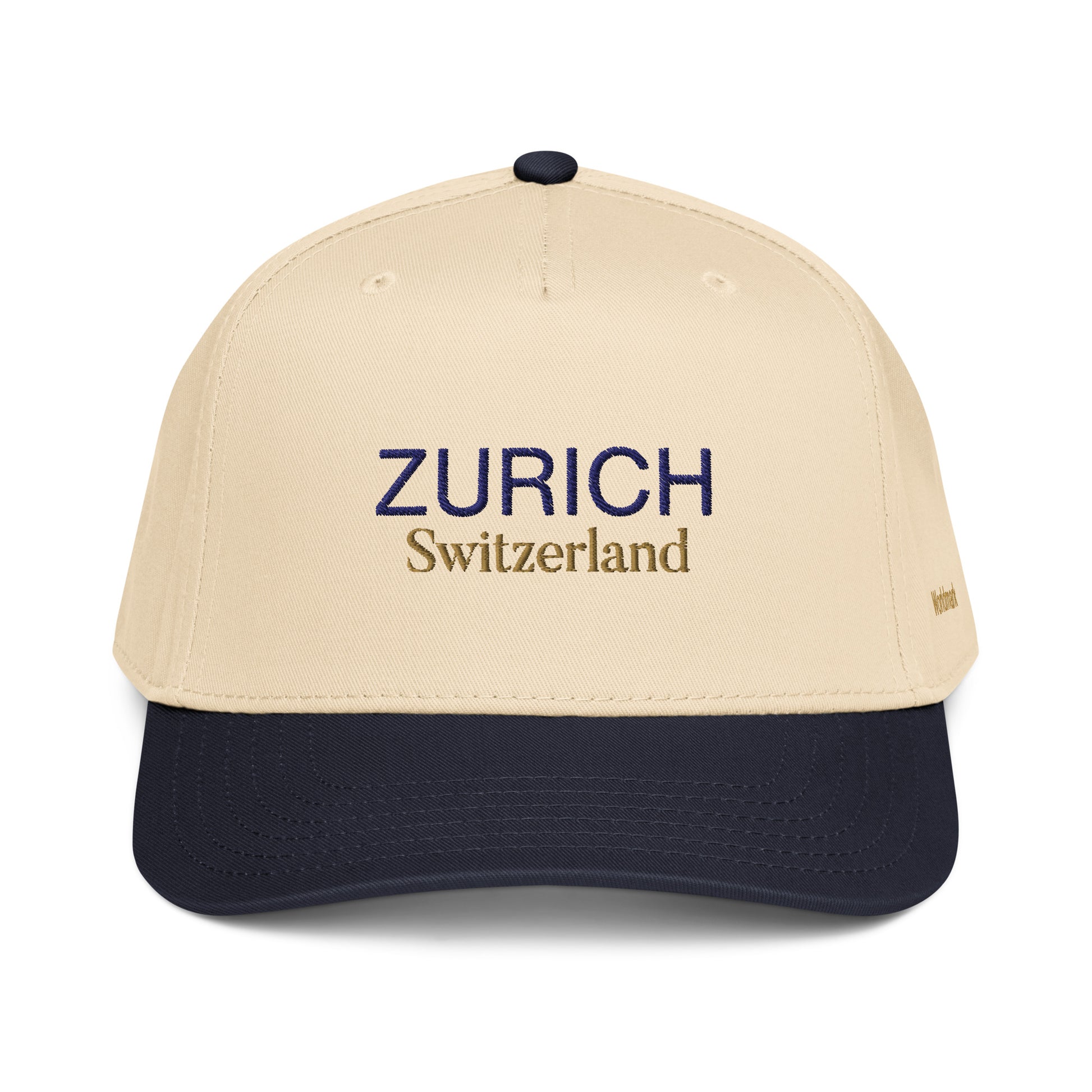 Two-tone cream and navy Zurich embroidered cap featuring gold “Switzerland” text and Worldmark logo — inspired by Swiss elegance and minimal European design.