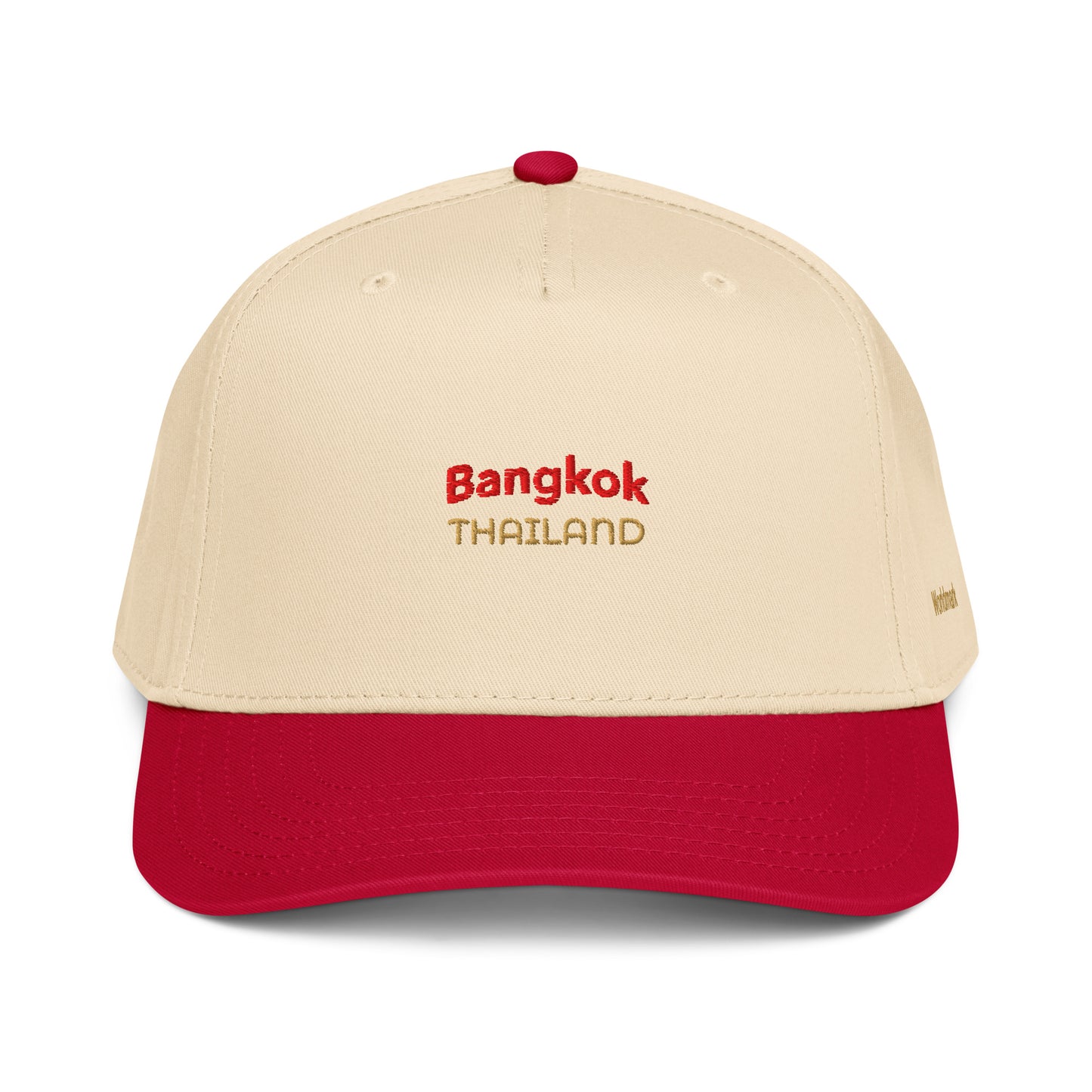 Two-tone cream and red Bangkok embroidered cap featuring gold “Thailand” text and Worldmark logo — inspired by Thai culture and vibrant street energy.