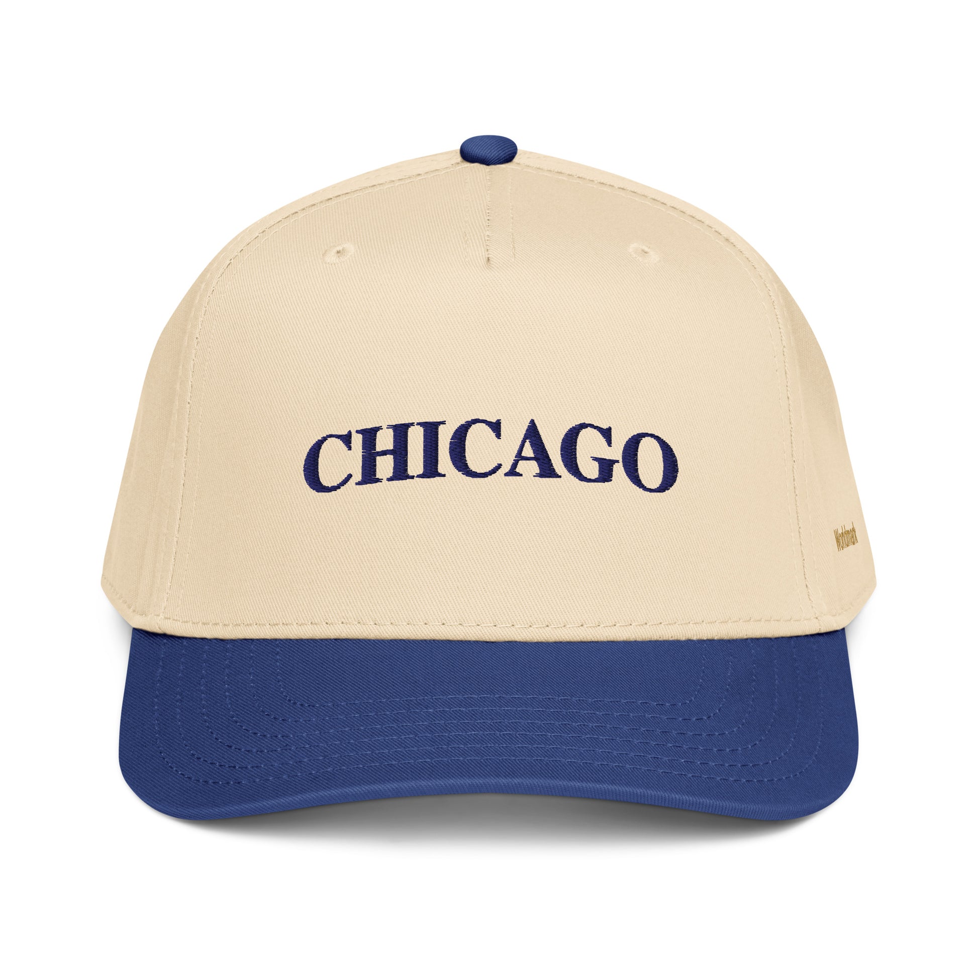 Two-tone cream and navy Chicago embroidered cap featuring minimalist serif typography and gold Worldmark logo — inspired by the Windy City.